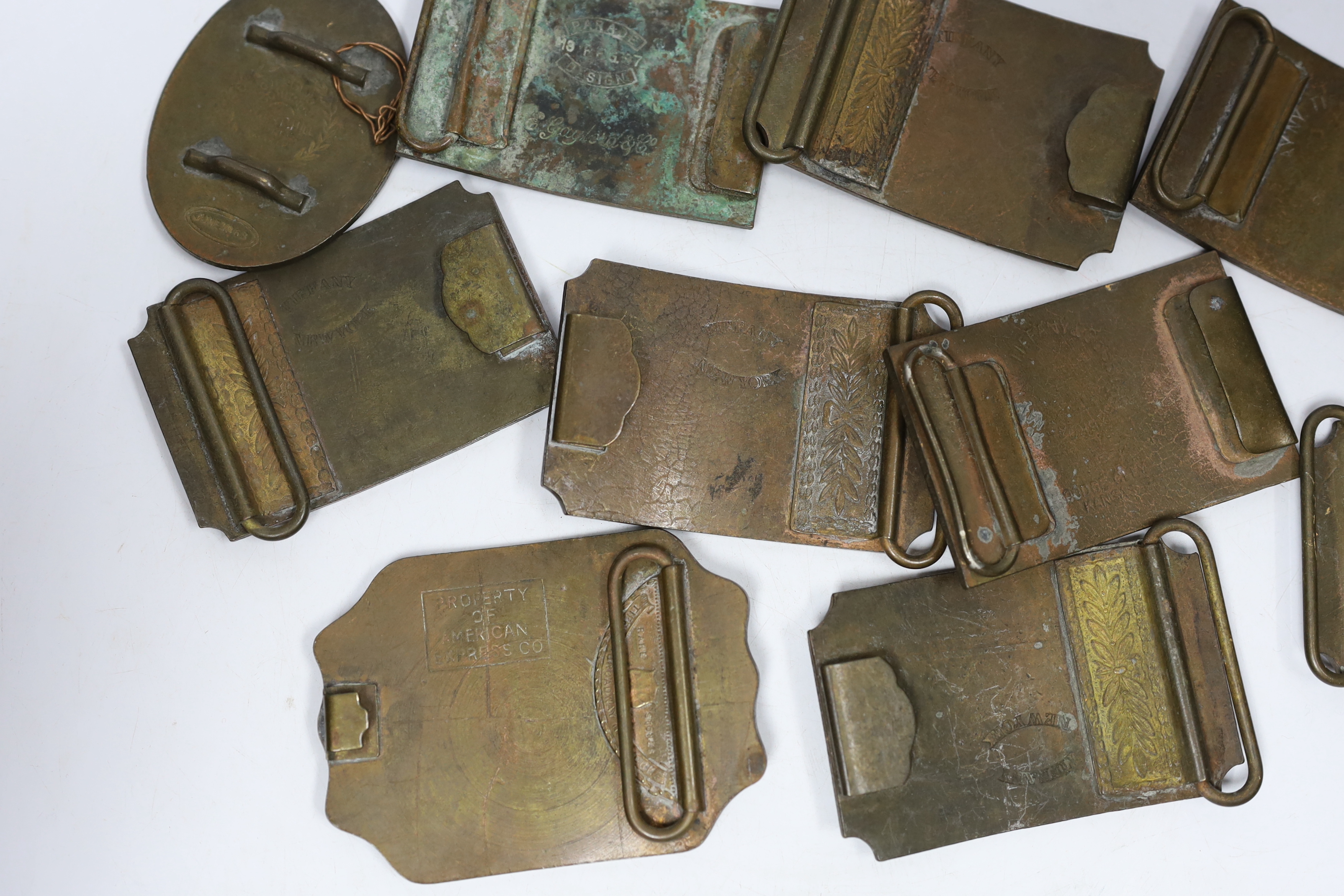 A collection of Wells Fargo and similar belt buckles, mostly by Tiffany & Co.